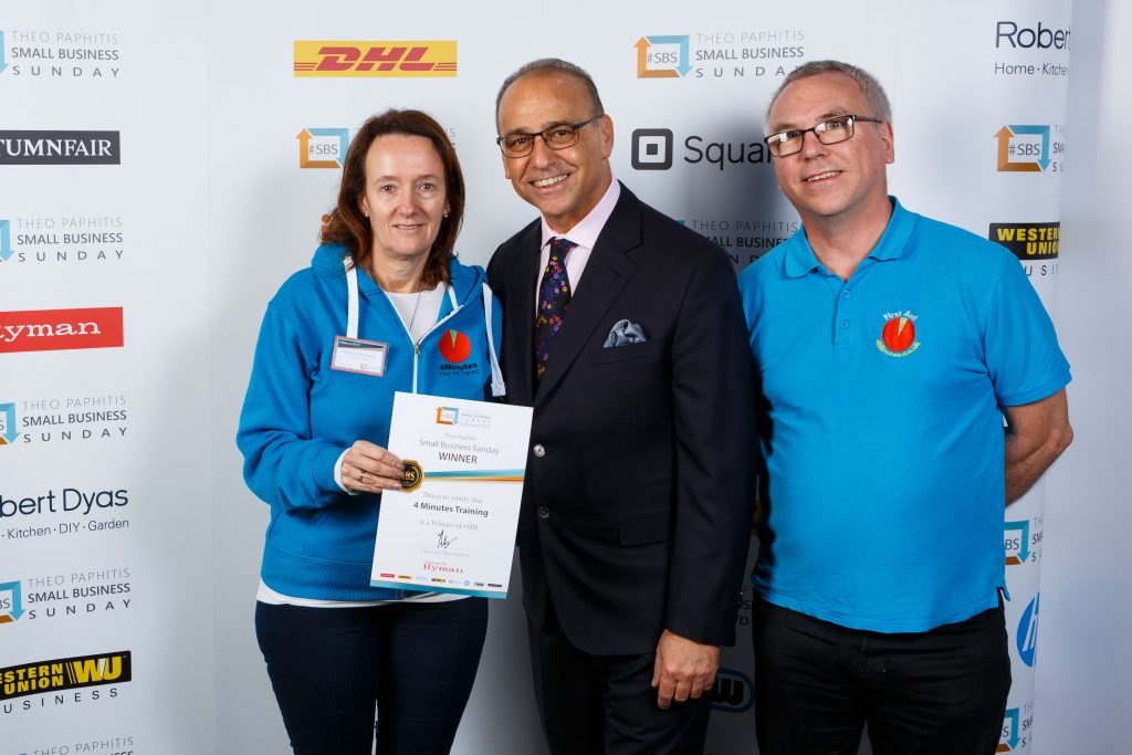two 4 minutes staff being presented with a certificate by theo paphitis